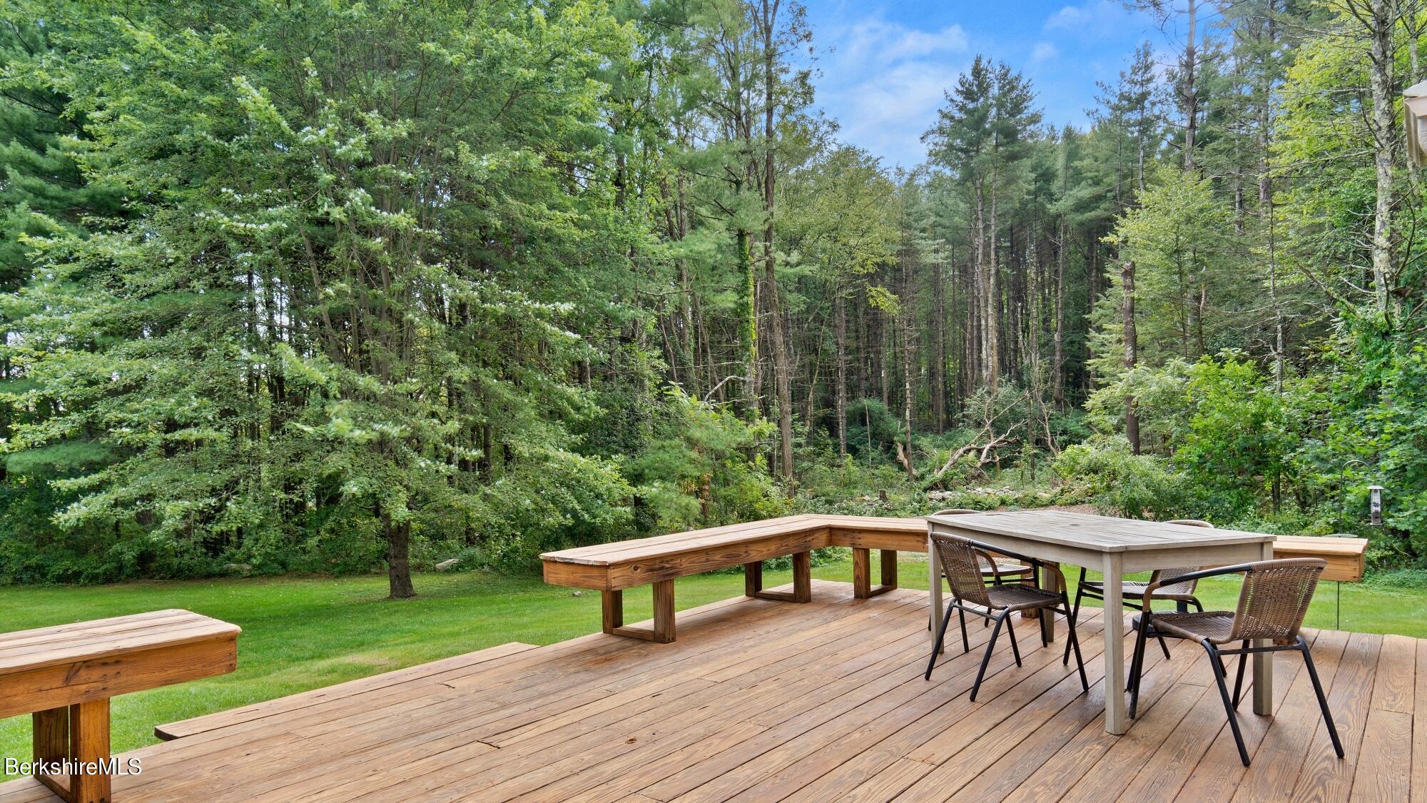 16 Squaw Peak Road Great Barrington, MA 01230 - Photo 10 of 38 a balcony with wooden floor table and chairs