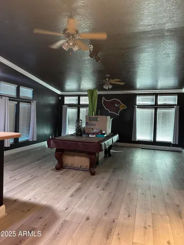 a bathroom with a sink a toilet a mirror and shower