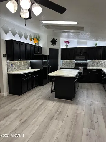 a living room with granite countertop furniture and a fireplace