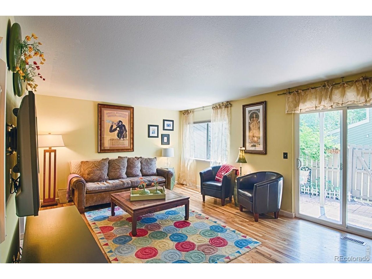 2948 Eagle Way Boulder, CO 80301 - Photo 11 of 29 a living room with furniture and a floor to ceiling window