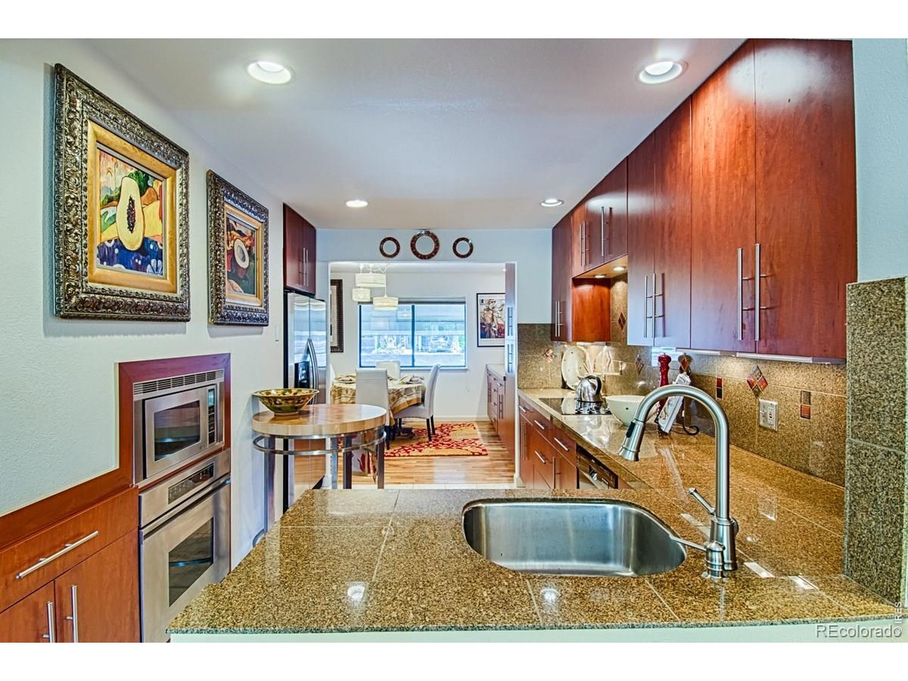 2948 Eagle Way Boulder, CO 80301 - Photo 9 of 29 a kitchen with stainless steel appliances granite countertop a sink and a microwave