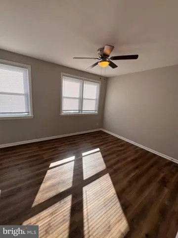 a view of room with wooden floor and window