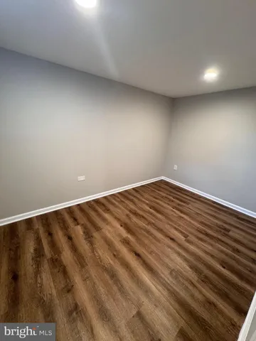 a view of room with wooden floor