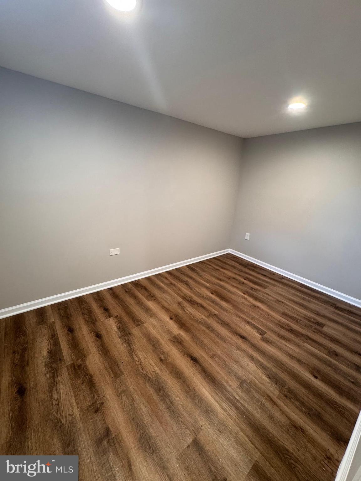169 Hampshire Road Baltimore, MD 21221 - Photo 13 of 20 a view of room with wooden floor
