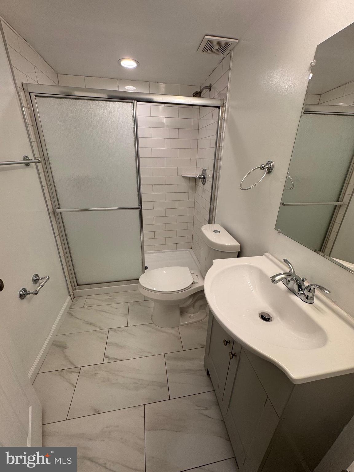 169 Hampshire Road Baltimore, MD 21221 - Photo 15 of 20 a bathroom with a sink toilet and shower