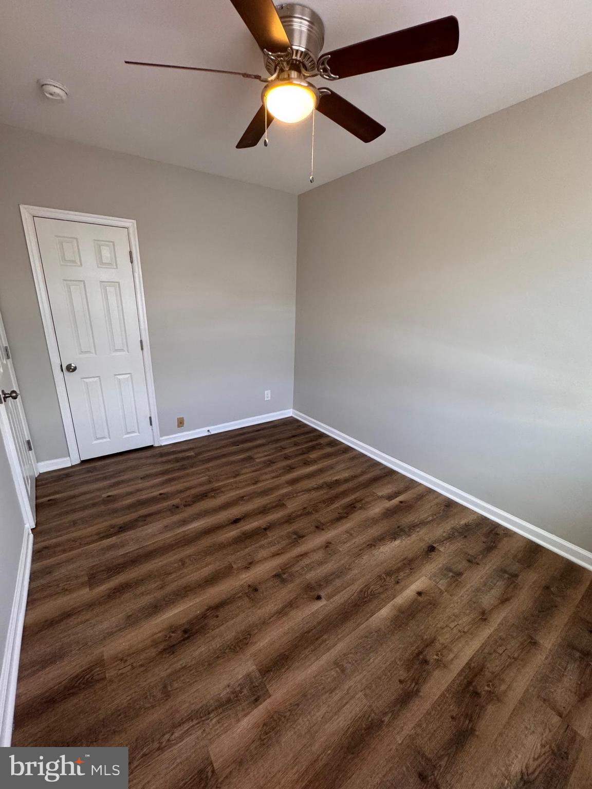 169 Hampshire Road Baltimore, MD 21221 - Photo 10 of 20 wooden floor in an empty room