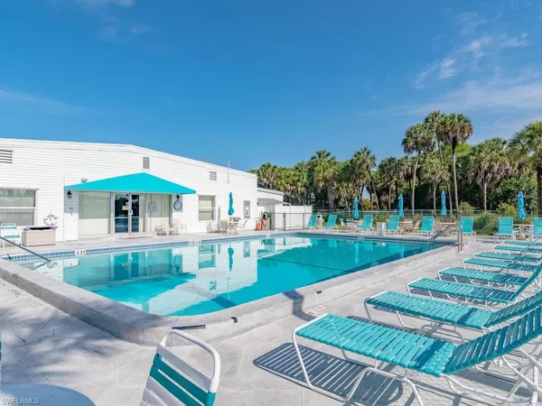 a view of a swimming pool with a patio