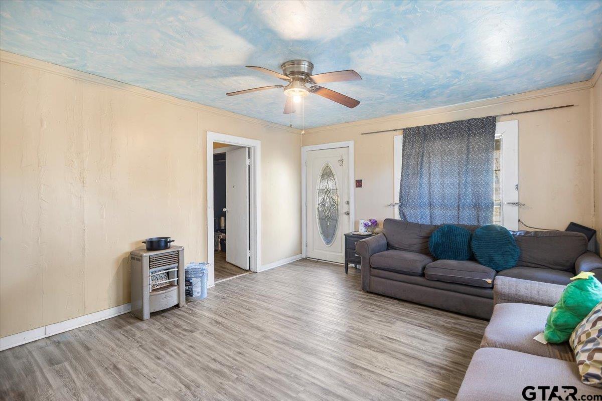 2516 Canton Street Tyler, TX 75702 - Photo 6 of 15 a living room with furniture and a ceiling fan