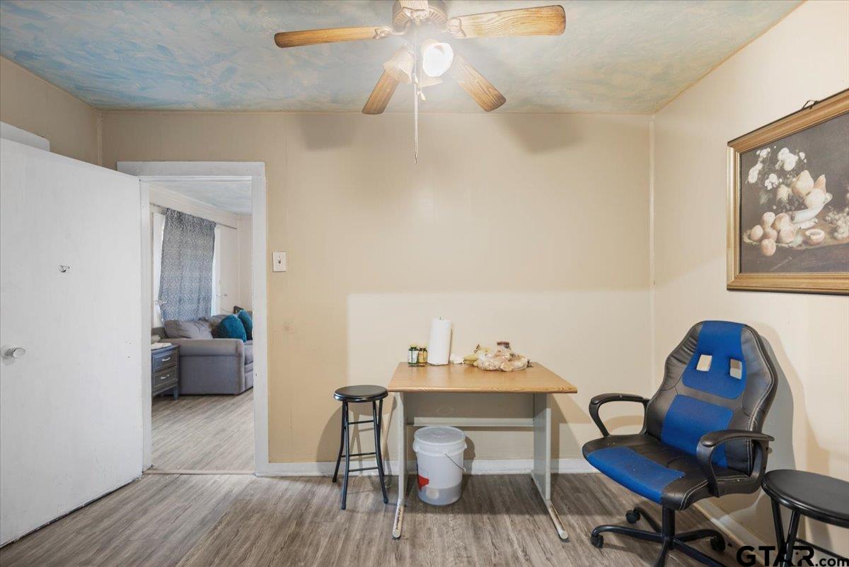 2516 Canton Street Tyler, TX 75702 - Photo 10 of 15 a view of a workspace with furniture and wooden floor
