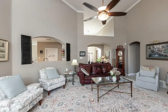 a bedroom with a bed couch and a window