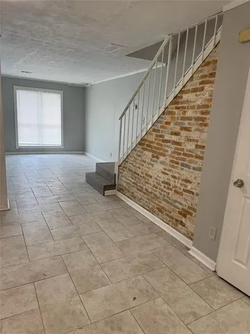 a view of entryway with stairs