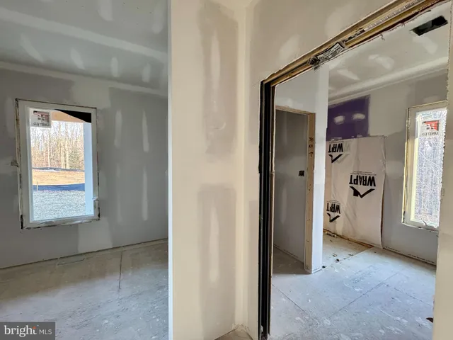 a reading room with furniture and a flat screen tv