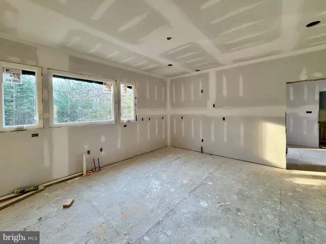 a bedroom with bed and wall painting