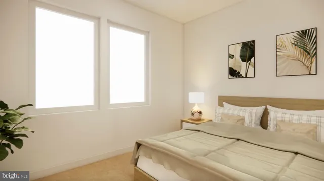 a view of a hallway with wooden floor and a bathroom