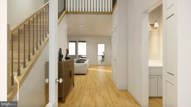a living room with furniture fireplace and a large window