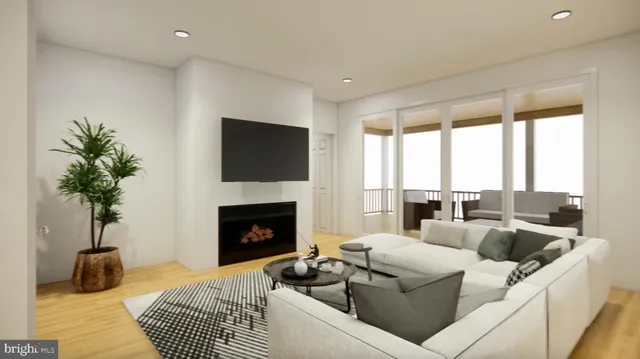 a kitchen with a sink a refrigerator and wooden floor