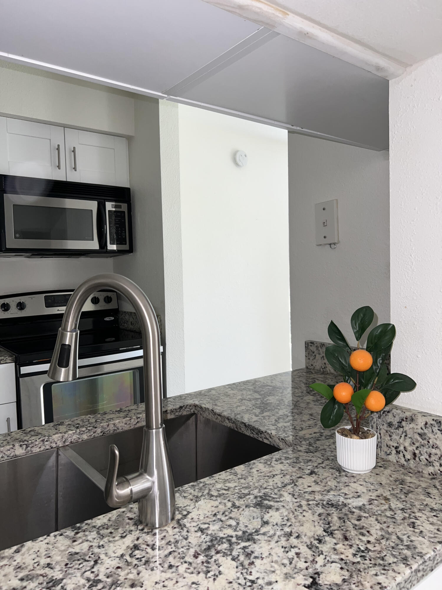 899 Riverside Drive, Unit 620 Coral Springs, FL 33071 - Photo 10 of 46 a view of a kitchen with a stove