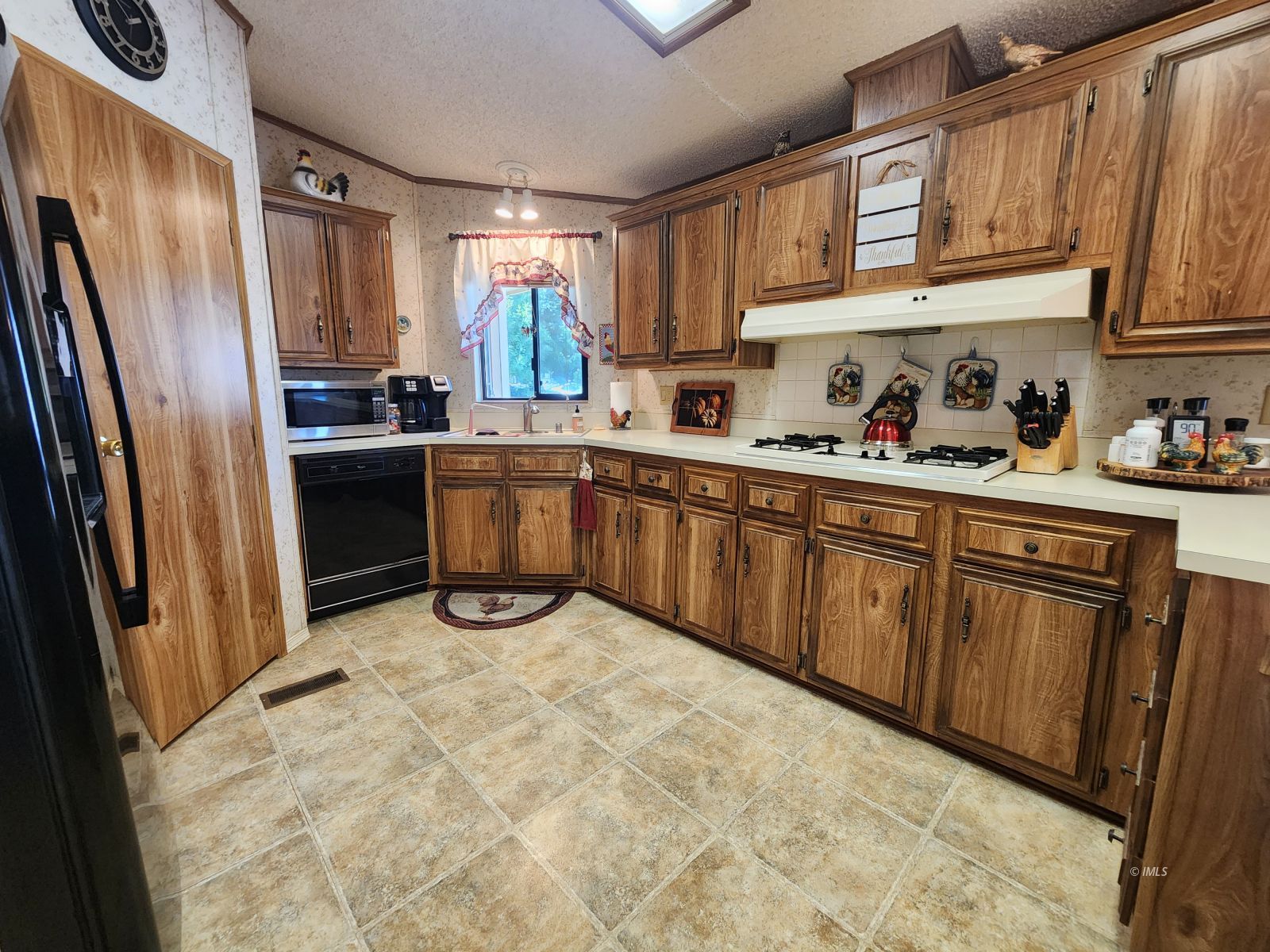 340 South Washington Street Independence, CA 93526 - Photo 11 of 18 a kitchen with stainless steel appliances granite countertop a refrigerator and sink