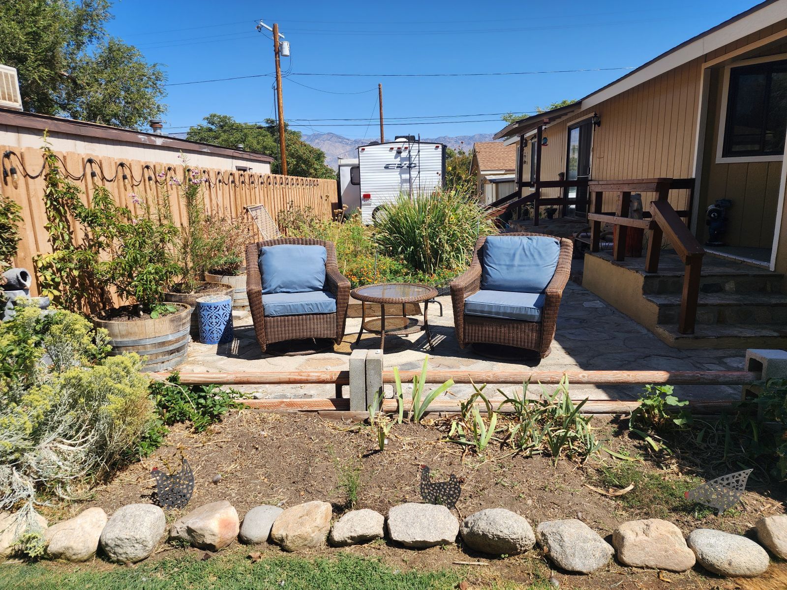 340 South Washington Street Independence, CA 93526 - Photo 2 of 18 a view of a patio with furniture and a yard