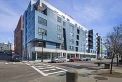 301 Border Street, Unit 406 Boston, MA 02128 - Photo 20 of 21 a city street lined with buildings and cars