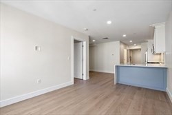 301 Border Street, Unit 406 Boston, MA 02128 - Photo 10 of 21 a view of kitchen with wooden floor
