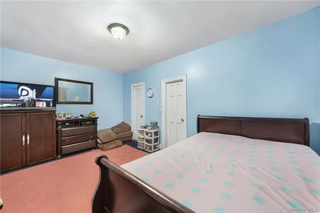 a bedroom with a bed and furniture