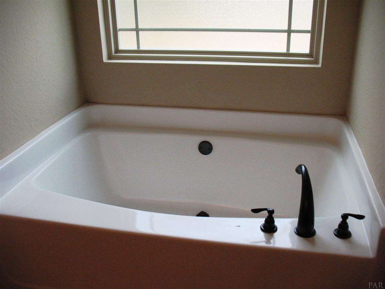 5622 Rosedown Court Milton, FL 32583 - Photo 12 of 28 Here is the master bath tub.