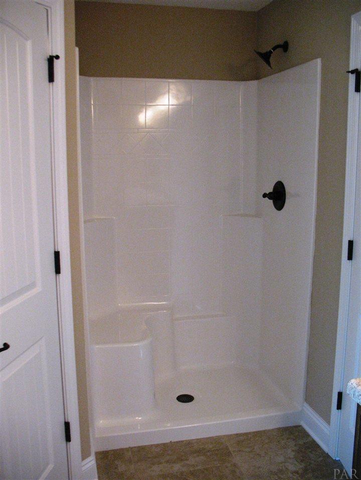 5622 Rosedown Court Milton, FL 32583 - Photo 14 of 28 Master bath shower features a built-in seat.