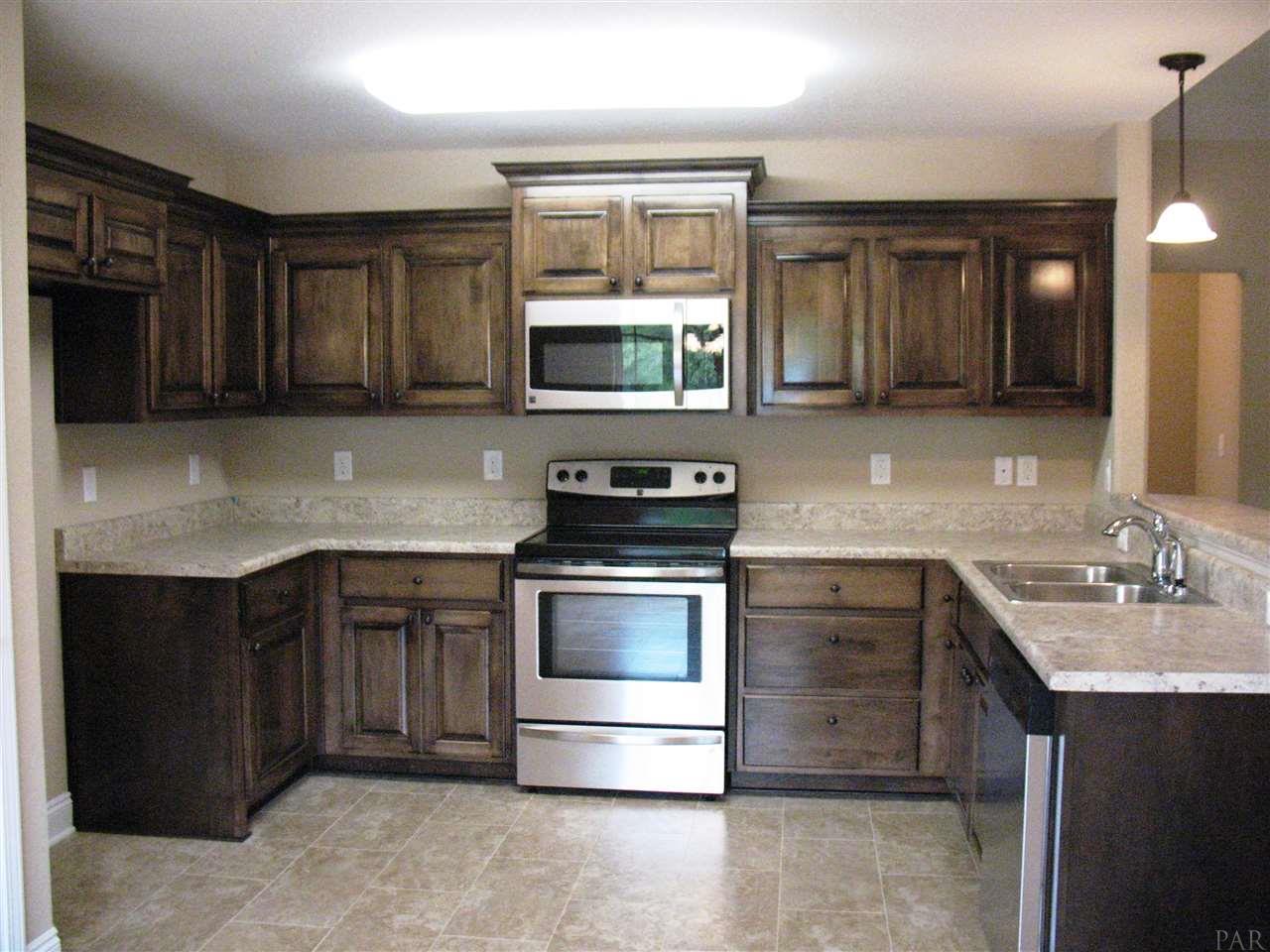 5622 Rosedown Court Milton, FL 32583 - Photo 16 of 28 A well-appointed kitchen adds polish to this plan!