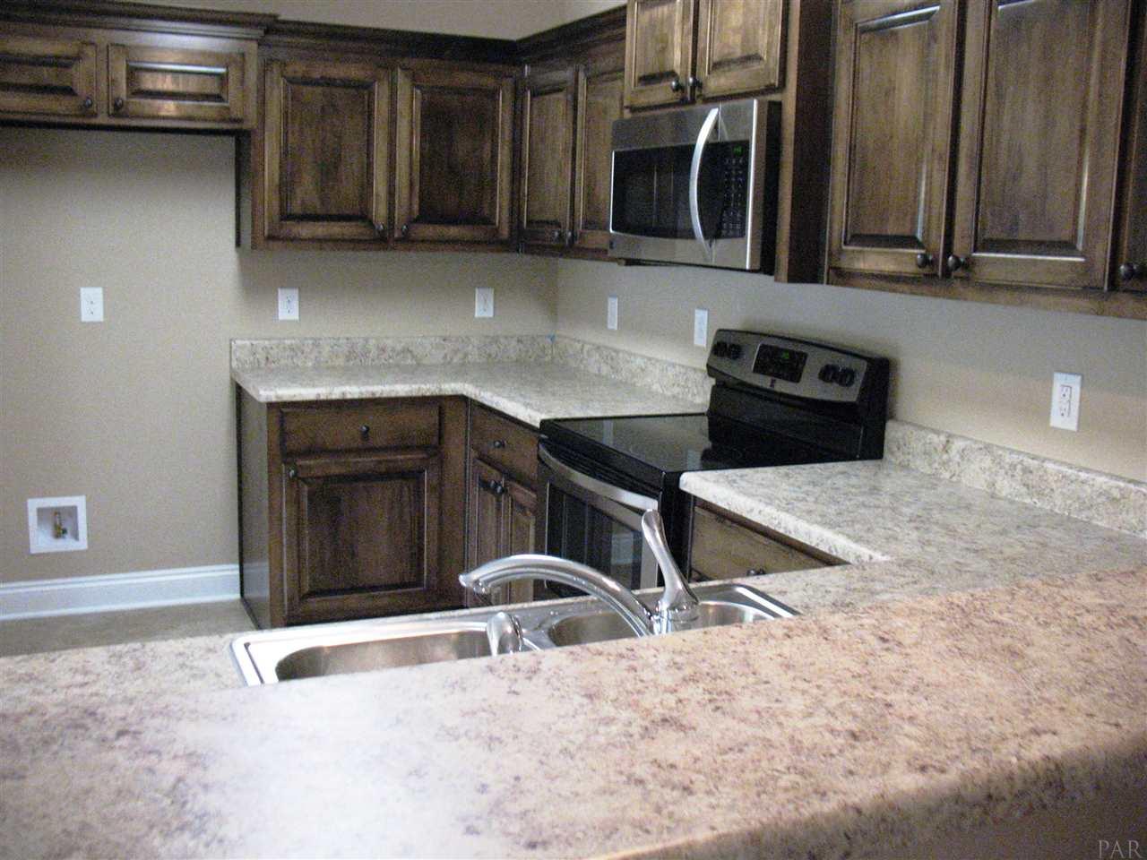 5622 Rosedown Court Milton, FL 32583 - Photo 18 of 28 Extra space is provided via this lovely bar area.