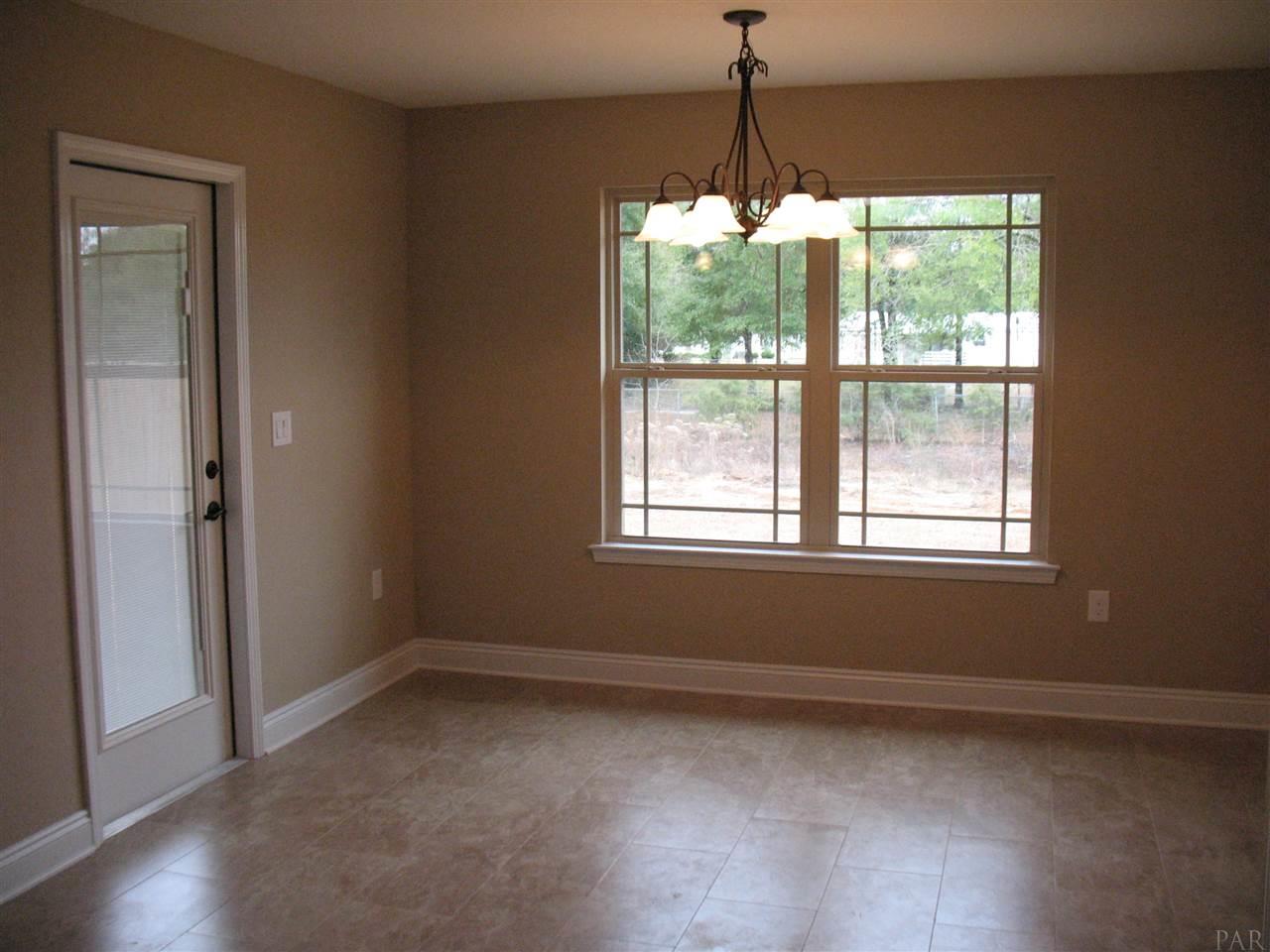 5622 Rosedown Court Milton, FL 32583 - Photo 19 of 28 A view of the dining room is seen here.