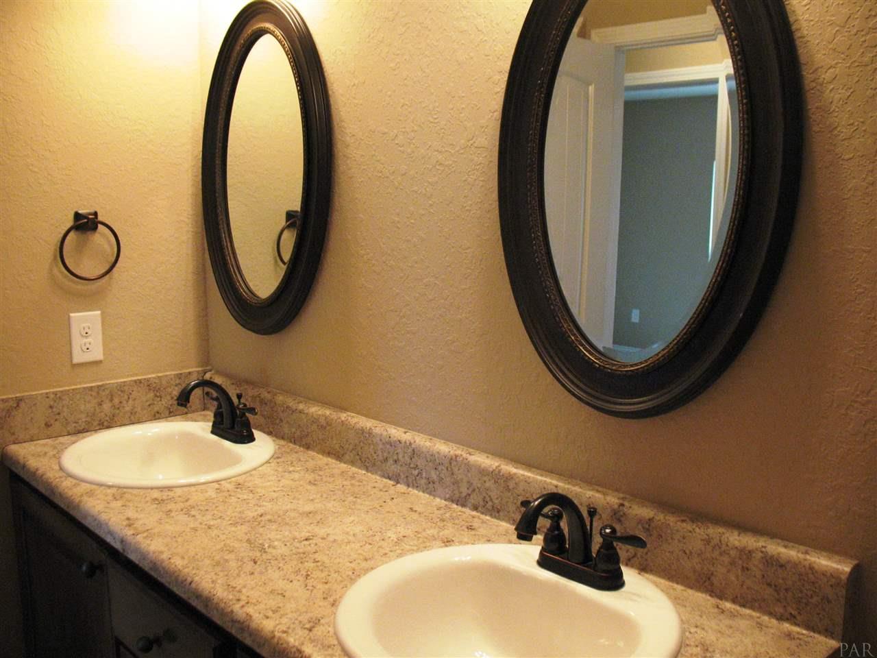 5622 Rosedown Court Milton, FL 32583 - Photo 22 of 28 Custom cabinets are done up in appealing colors.