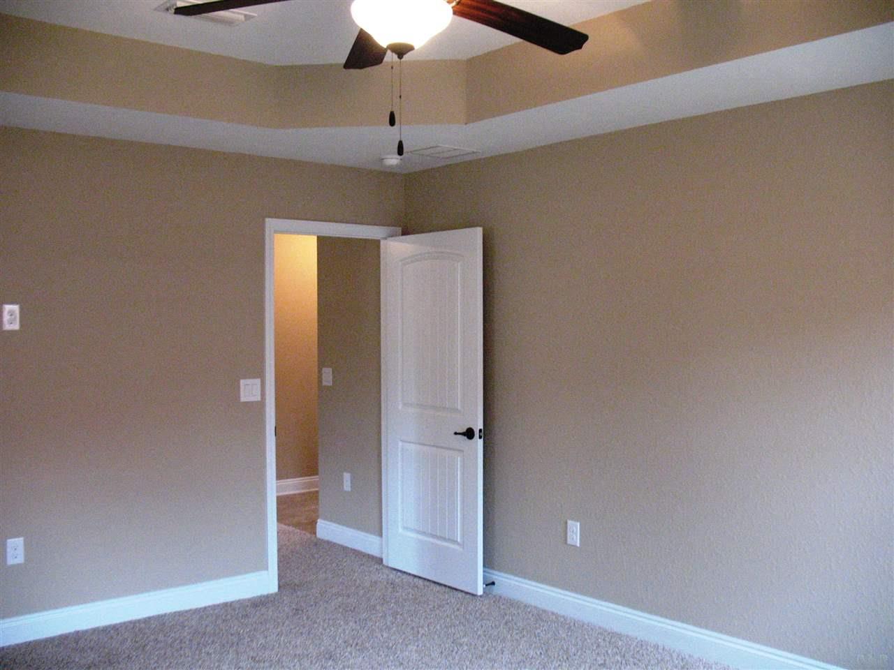 5622 Rosedown Court Milton, FL 32583 - Photo 8 of 28 A boxed ceiling is eye-catching in the master.