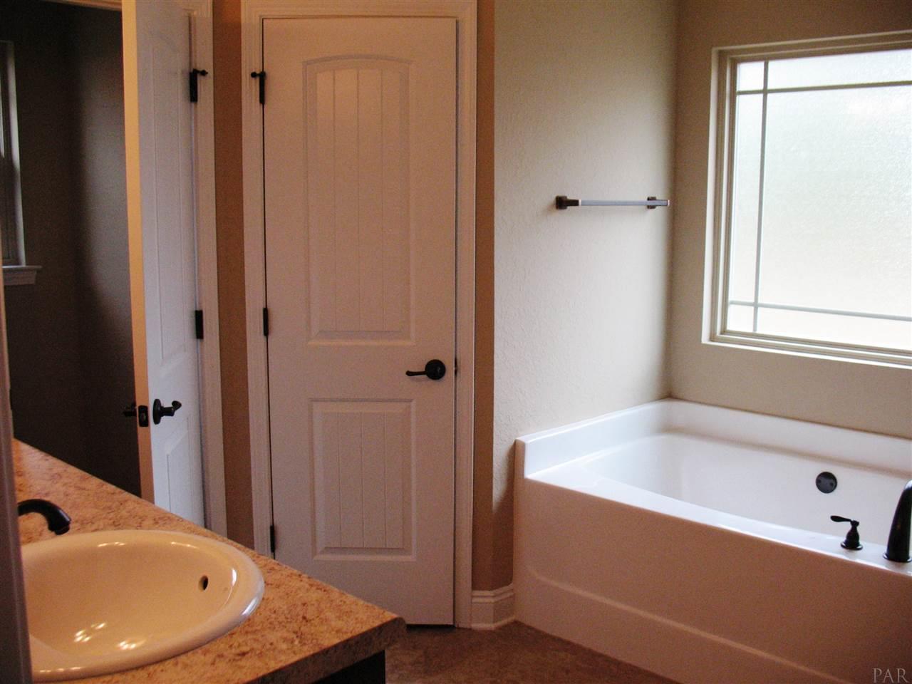 5622 Rosedown Court Milton, FL 32583 - Photo 9 of 28 The master bath is seen here.