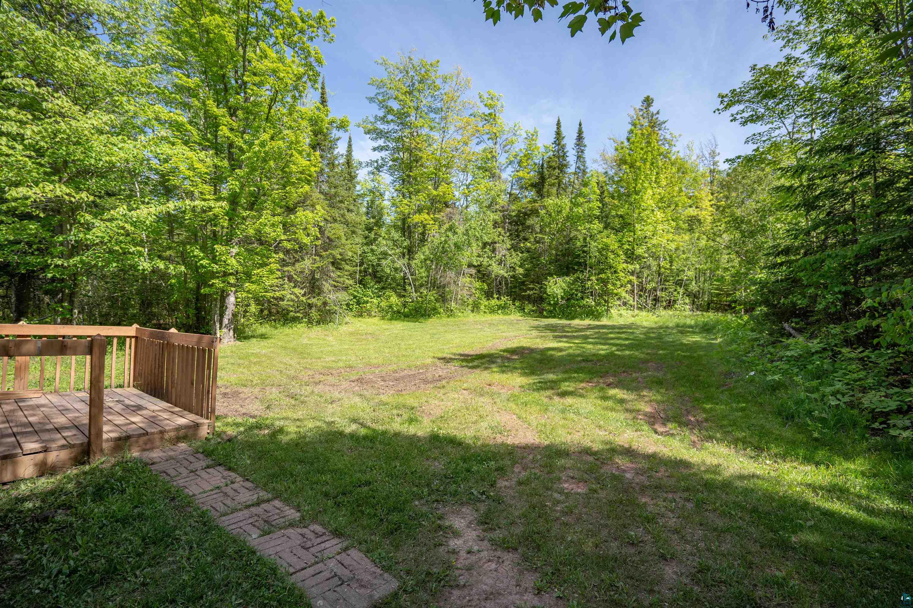 9076 East Moonshine Road South Range, WI 54874 - Photo 25 of 26 View of yard featuring a wooden deck