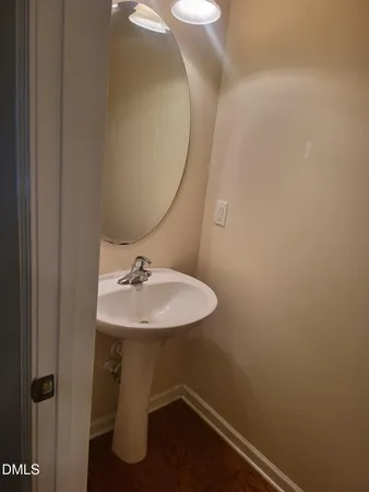 a bathroom with a sink and mirror