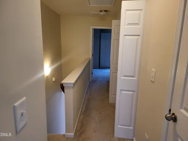 a view of a hallway with entryway
