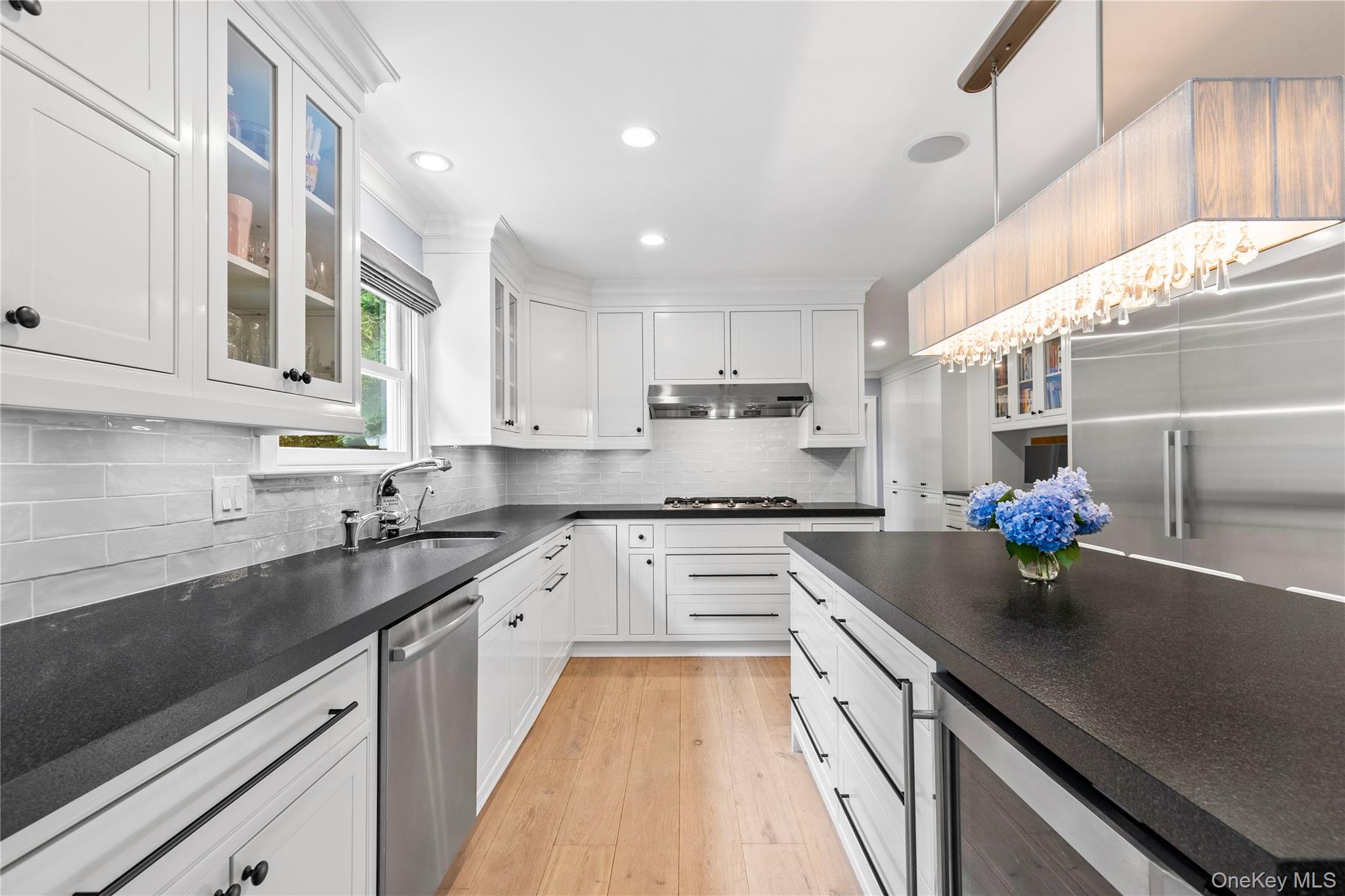 394 Park Avenue Rye, NY 10580 - Photo 10 of 36 Black granite Island with seating for 4