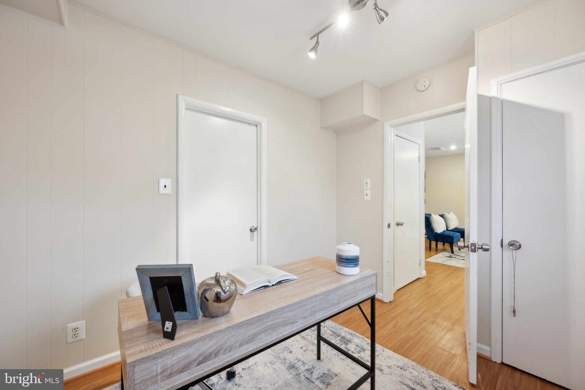 4231 32nd Road South Arlington, VA 22206 - Photo 29 of 44 a view of a workspace with furniture and mirror