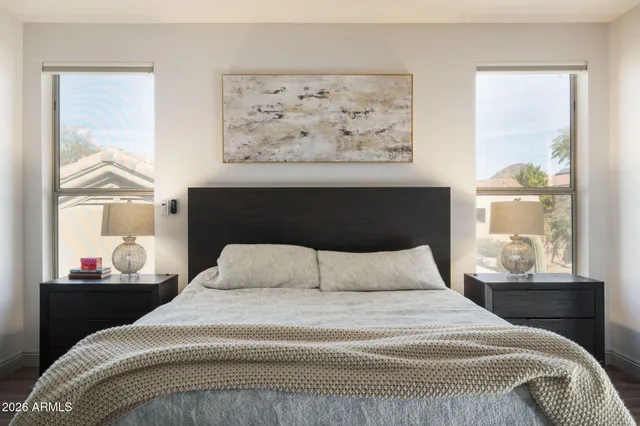 a bedroom with a bed and window