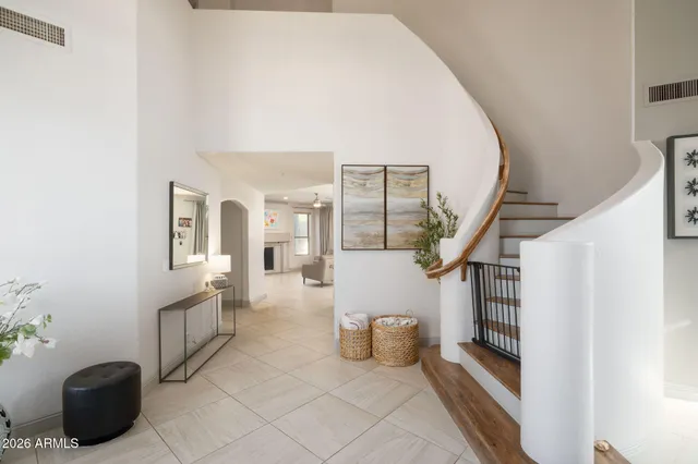 a view of a livingroom with furniture and stairs