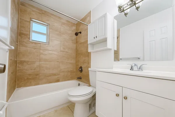 a bathroom with a sink a toilet and a bathtub