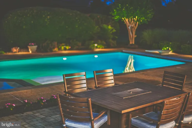 an aerial view of a pool patio swimming pool and outdoor seating