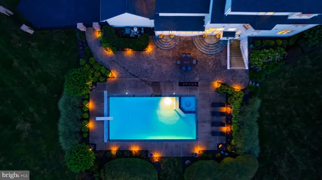 a view of a house with a yard and a sitting area