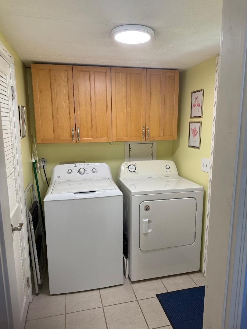 27973 Snapper Lane Summerland Key, FL 33042 - Photo 11 of 25 a utility room with dryer and washer