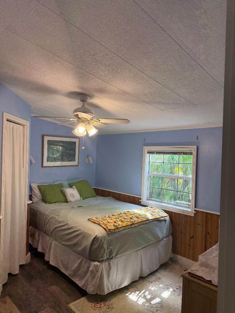 27973 Snapper Lane Summerland Key, FL 33042 - Photo 16 of 25 a bedroom with a bed and a window