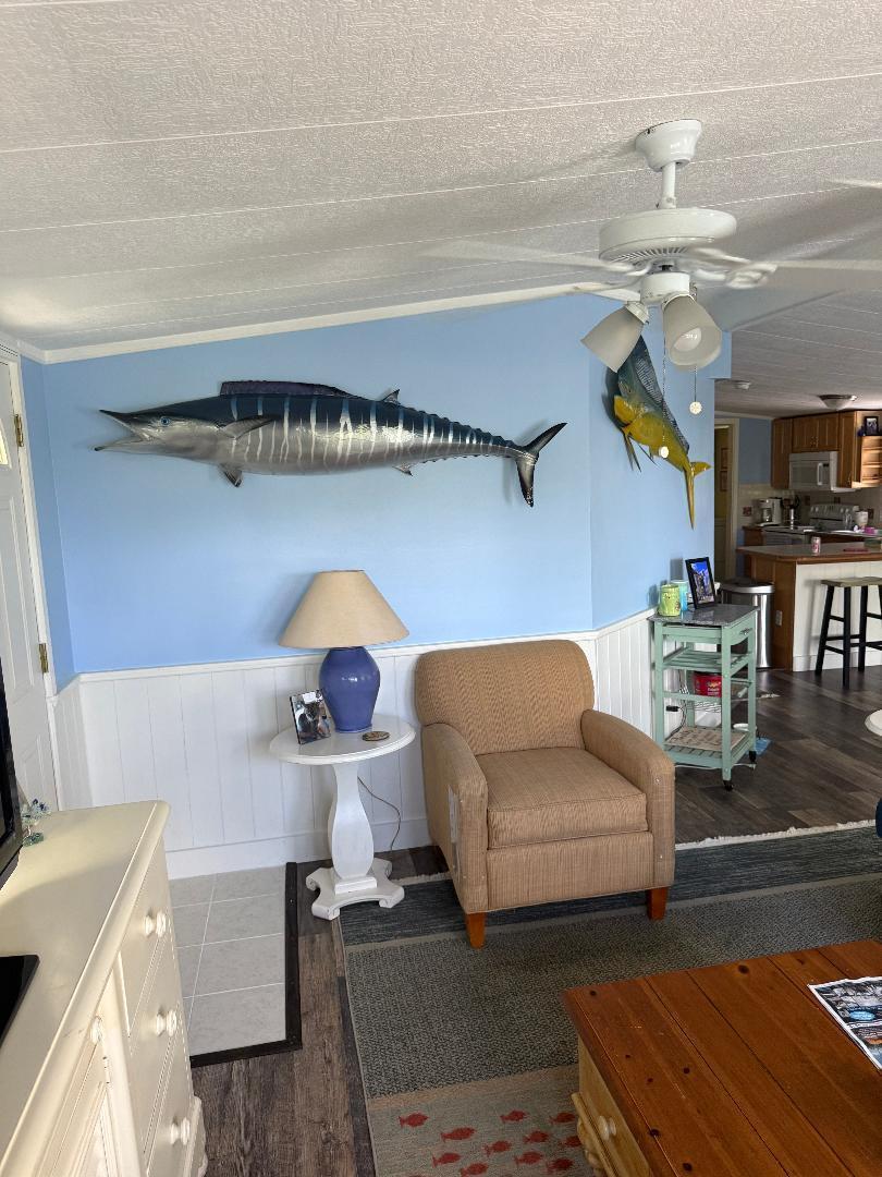 27973 Snapper Lane Summerland Key, FL 33042 - Photo 17 of 25 a living room with furniture and a chandelier