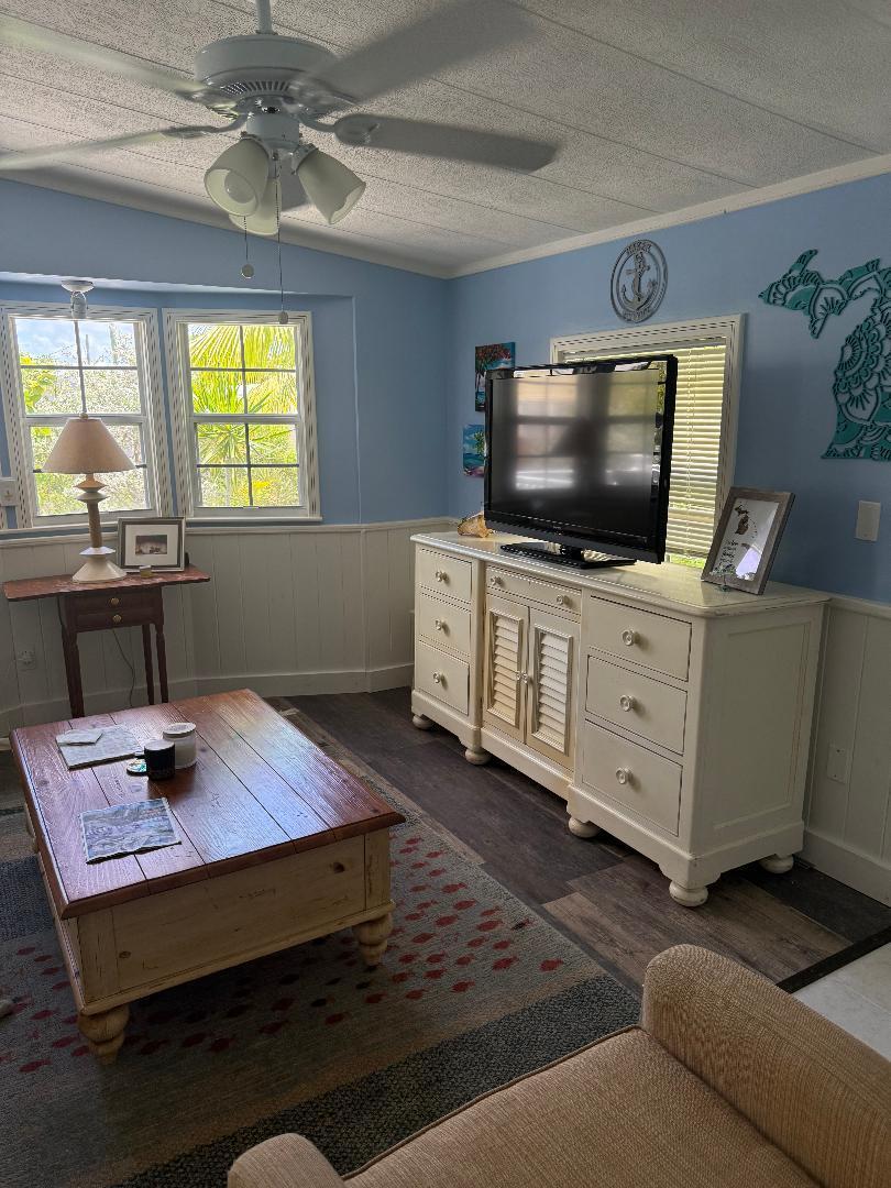 27973 Snapper Lane Summerland Key, FL 33042 - Photo 18 of 25 a living room with furniture and a flat screen tv