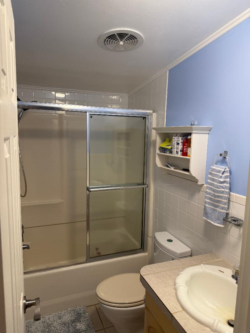 27973 Snapper Lane Summerland Key, FL 33042 - Photo 20 of 25 a bathroom with a sink toilet and shower
