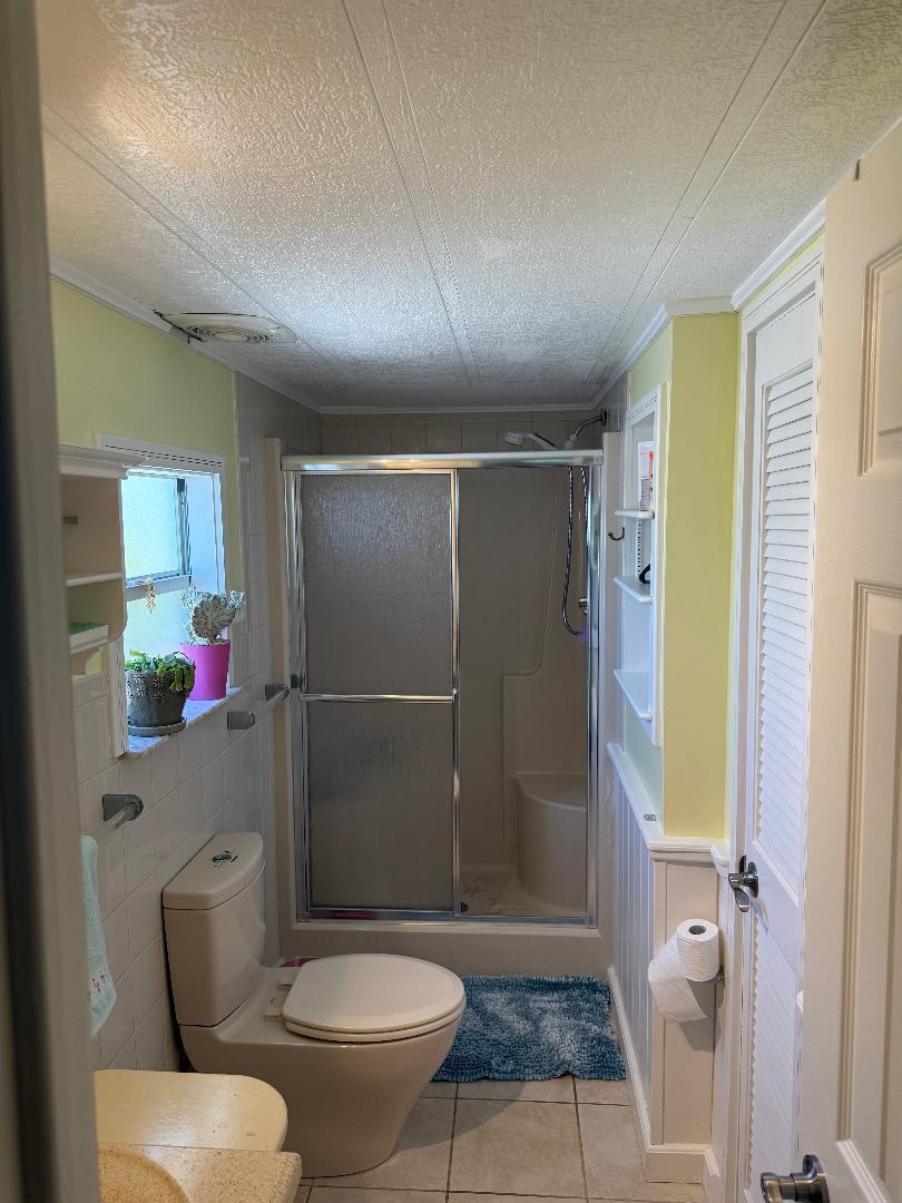 27973 Snapper Lane Summerland Key, FL 33042 - Photo 21 of 25 a bathroom with a toilet and a shower